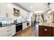 Bright kitchen with stainless steel appliances, black countertops, and a view of the backyard at 6346 Dallas Blvd, Orlando, FL 32833