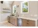 Stylish bar area with granite countertop, sink, mini-fridge and floating shelves at 721 Delaney Ave, Orlando, FL 32801