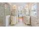 Luxurious bathroom with double vanities, marble countertops, and a glass-enclosed shower at 721 Delaney Ave, Orlando, FL 32801