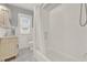 Bright bathroom boasts a subway tile shower, marble mosaic tile floors, and a vanity with ornate detail at 721 Delaney Ave, Orlando, FL 32801