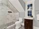 Modern bathroom featuring marble walk-in shower, black and white patterned tile floor and pedestal sink at 721 Delaney Ave, Orlando, FL 32801