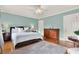 Light-filled bedroom with hardwood floors, a ceiling fan, and neutral color palette at 721 Delaney Ave, Orlando, FL 32801