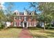 Charming brick home with well-manicured lawn and classic architectural details at 721 Delaney Ave, Orlando, FL 32801