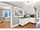 Cozy kitchen featuring white cabinets, black countertops, and terra cotta tile flooring at 721 Delaney Ave, Orlando, FL 32801