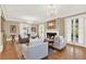 Cozy living room featuring a fireplace, hardwood floors, and plenty of natural light at 721 Delaney Ave, Orlando, FL 32801