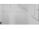 Empty white closet with a metal shelf and white door at 7821 Waterscape Dr, Groveland, FL 34736