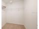 Empty walk-in closet with wire shelving and carpeted floors at 7823 Waterscape Dr, Groveland, FL 34736