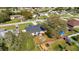 Aerial view of a home with a well-maintained lawn, fenced backyard, and patio seating area at 970 Picasso Ave, Deltona, FL 32738