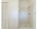 Bright bathroom featuring a tiled shower with a showerhead at 10238 Summit Square Dr, Leesburg, FL 34788