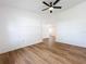 Bedroom with wood-look flooring and a ceiling fan at 10238 Summit Square Dr, Leesburg, FL 34788