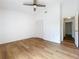 Bedroom with wood-look flooring, closet, and a ceiling fan at 10238 Summit Square Dr, Leesburg, FL 34788