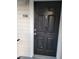 The black colored front door of the property is numbered 2027 at 1055 S Hiawassee Rd # 2027, Orlando, FL 32835