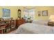 Bright bedroom with twin beds, paisley comforters, and a bookshelf at 107 Springhurst Cir, Lake Mary, FL 32746