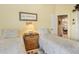 Bright bedroom with twin beds, paisley comforters, and a dresser at 107 Springhurst Cir, Lake Mary, FL 32746