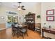 Bright dining room featuring a wooden table, hutch, and direct access to the outdoor pool at 107 Springhurst Cir, Lake Mary, FL 32746