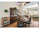 Traditional dining room featuring a wooden table, hutch, and bright natural lighting at 107 Springhurst Cir, Lake Mary, FL 32746