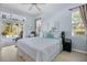 Spacious main bedroom with a ceiling fan and a sliding glass door to the outdoor space at 107 Springhurst Cir, Lake Mary, FL 32746