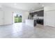 Contemporary kitchen and dining area featuring stainless steel appliances, dark cabinets, and a view to the backyard at 13220 Sw 85Th Cir, Ocala, FL 34473