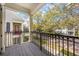 Balcony view overlooking a street with trees and multi-story buildings in a residential area at 1531 Lake Baldwin Ln, Orlando, FL 32814