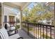 Relaxing balcony with comfortable seating overlooking a charming street at 1531 Lake Baldwin Ln, Orlando, FL 32814