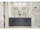 Elegant bathroom featuring double sinks, marble walls, and a luxurious shower at 1531 Lake Baldwin Ln, Orlando, FL 32814