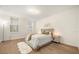 Bright bedroom features a queen-size bed, neutral walls and hardwood floors at 1531 Lake Baldwin Ln, Orlando, FL 32814