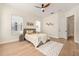 Bedroom features wood floors, neutral walls, ceiling fan, and a patterned rug that enhances the room at 1531 Lake Baldwin Ln, Orlando, FL 32814