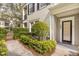 A well-maintained entrance with lush landscaping, a gate, and clear house number display at 1531 Lake Baldwin Ln, Orlando, FL 32814