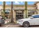 Retail storefront with palm trees along a brick-paved street with vehicle parking at 1531 Lake Baldwin Ln, Orlando, FL 32814