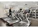 Community gym with multiple treadmills for cardio workouts and a mirror wall for weight training at 1531 Lake Baldwin Ln, Orlando, FL 32814