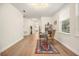 Hallway shows an office with a desk, hardwood floors and neutral walls at 1531 Lake Baldwin Ln, Orlando, FL 32814