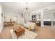 Bright and airy living area connecting to the kitchen, featuring stylish decor, hardwood floors, and modern lighting at 1531 Lake Baldwin Ln, Orlando, FL 32814