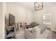 Comfortable living room with neutral tones, modern decor, and a view into the adjacent bedroom at 1531 Lake Baldwin Ln, Orlando, FL 32814