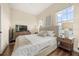 Relaxing main bedroom with hardwood floors and serene natural light from large windows at 1531 Lake Baldwin Ln, Orlando, FL 32814