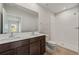 Bathroom featuring a double sink vanity, large mirror, and a walk-in shower with white tiles at 1630 Laia Rd, Haines City, FL 33844