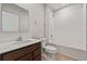 Bathroom featuring a single sink vanity, and a shower-tub combo with white tiles at 1630 Laia Rd, Haines City, FL 33844