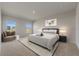 Bright bedroom featuring neutral walls, carpet floors, and a cozy seating area near the windows at 1630 Laia Rd, Haines City, FL 33844