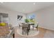 Cozy dining area with a round table, neutral chairs, and sliding glass doors at 1630 Laia Rd, Haines City, FL 33844