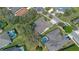 This overhead view shows a well-manicured lot with screened pool in a community with mature trees at 1657 Cherry Ridge Dr, Lake Mary, FL 32746