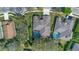 Bird's eye view of home with screened-in pool, showcasing a neatly landscaped backyard and neighboring properties at 1657 Cherry Ridge Dr, Lake Mary, FL 32746