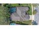 Aerial view of a well-maintained home with a screened-in pool and lush backyard at 1657 Cherry Ridge Dr, Lake Mary, FL 32746