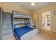 Cozy bedroom featuring a bunk bed, a closet, and an en suite bathroom at 1657 Cherry Ridge Dr, Lake Mary, FL 32746