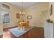 Bright dining area with hardwood floors, chandelier, and large windows, perfect for Gathering meals at 1657 Cherry Ridge Dr, Lake Mary, FL 32746