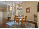 Bright dining area with hardwood floors, chandelier, and large windows, perfect for Gathering meals at 1657 Cherry Ridge Dr, Lake Mary, FL 32746