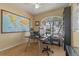 Office with a world map on the wall, a computer desk in front of the window, and carpet floors at 1657 Cherry Ridge Dr, Lake Mary, FL 32746