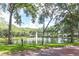 Scenic view of a community pond featuring a fountain, surrounded by lush greenery and walking paths at 1657 Cherry Ridge Dr, Lake Mary, FL 32746