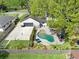 A high angle view of a backyard with a beautiful pool and patio at 1804 Wind Willow Rd, Belle Isle, FL 32809