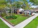 An aerial view of a beautiful home with a lush green lawn at 1804 Wind Willow Rd, Belle Isle, FL 32809