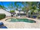 Beautiful backyard featuring a kidney-shaped pool, brick pavers, lush landscaping, and outdoor furniture at 1804 Wind Willow Rd, Belle Isle, FL 32809