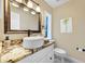 This bathroom offers a granite vanity top and an above counter sink at 1804 Wind Willow Rd, Belle Isle, FL 32809